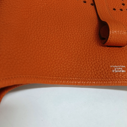 HERMÈS Evelyne GM Hermes orange Clemence leather Evelyne GM bag crossbody bag with handle, silver hardware, embossed H, removable shoulder strap-(SKU)-961912745