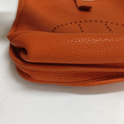 HERMÈS Evelyne GM Hermes orange Clemence leather Evelyne GM bag crossbody bag with handle, silver hardware, embossed H, removable shoulder strap-(SKU)-961912745